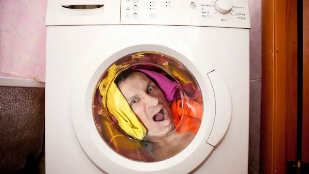 Face of a man locked in washing machine